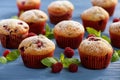 Sweet homemade raspberry muffins on wooden table. Royalty Free Stock Photo