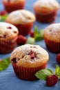 Sweet homemade raspberry muffins on wooden table. Royalty Free Stock Photo