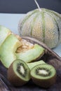 Sweet honeydew melons and sour fresh kiwis Royalty Free Stock Photo
