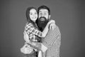 Sweet hug. Man bearded father and cute little girl daughter on red background. Celebrate fathers day. Family values Royalty Free Stock Photo