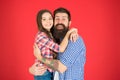 Sweet hug. Man bearded father and cute little girl daughter on red background. Celebrate fathers day. Family values Royalty Free Stock Photo