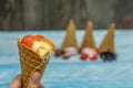 Sweet ice cream in balls in a waffle cone. Different flavors berries and fruits Royalty Free Stock Photo