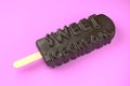 Sweet icecream text on classic chocolate ice cream isolated on pink background 3d illustration