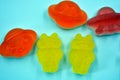 Sweet jelly candies, sweets in the form of aliens space rockets, astronauts, alien ships and planet, asteroids.