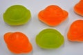 Sweet jelly candies, sweets in the form of aliens space rockets, astronauts, alien ships and planet, asteroids.