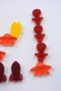 Sweet jelly candies, sweets in the form of aliens space rockets, astronauts, alien ships and planet, asteroids.