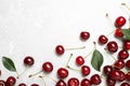 Sweet juicy cherries with leaves on marble table, flat lay. Space for text Royalty Free Stock Photo