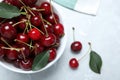 Sweet juicy cherries with leaves on marble table, top view Royalty Free Stock Photo