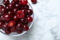 Sweet juicy cherries on white marble table, top view. Space for text Royalty Free Stock Photo