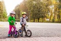 Sweet kids on balance bikes outdoors at the park Royalty Free Stock Photo