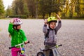Sweet kids on balance bikes outdoors at the park Royalty Free Stock Photo