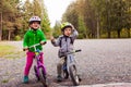 Sweet kids on balance bikes outdoors at the park Royalty Free Stock Photo