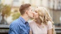Sweet kiss of beautiful young couple in love, happy people enjoying romance Royalty Free Stock Photo