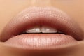 Sweet kiss. Perfect natural lip makeup. Close up macro photo with beautiful female mouth. Plump full lips