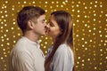 Sweet kiss, young kissing beautiful people in love, boy and girl lovers express affection Royalty Free Stock Photo