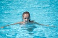 Sweet lady in the pool looking at the camera Royalty Free Stock Photo