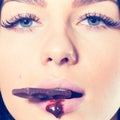 Sweet lips and chocolate bar Royalty Free Stock Photo