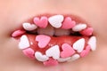 Sweet lips with the sugar hearts Royalty Free Stock Photo