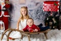 Sweet little baby boy and girl with christmas decorations, playing in the snow Royalty Free Stock Photo