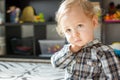 Sweet little baby boy portrait at home, with toys in the background Royalty Free Stock Photo