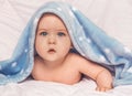 Sweet little blue eyes baby boy portrait with blue blanket on white background Royalty Free Stock Photo