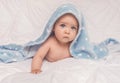 Sweet little blue eyes baby boy portrait with blue blanket on white background Royalty Free Stock Photo