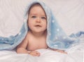 Sweet little blue eyes baby boy portrait with blue blanket on white background Royalty Free Stock Photo