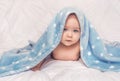 Sweet little blue eyes baby boy portrait with blue blanket on white background Royalty Free Stock Photo