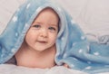 Sweet little blue eyes baby boy portrait with blue blanket on white background Royalty Free Stock Photo