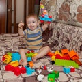 Sweet little boy building tower from cubes at home Royalty Free Stock Photo