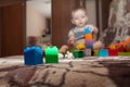 Sweet little boy building tower from cubes at home Royalty Free Stock Photo