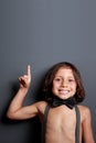 Sweet little boy pointing upwards Royalty Free Stock Photo