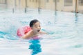 Sweet little boy, swimming in big swimming pool, summertime Royalty Free Stock Photo