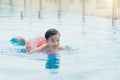 Sweet little boy, swimming in big swimming pool, summertime Royalty Free Stock Photo