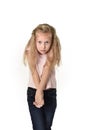 Sweet little child girl with beautiful blonde hair in casual clothes looking shy and timid as if scared Royalty Free Stock Photo