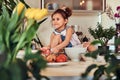 Sweet little cute girl learns to cook a meal in the kitchen. Royalty Free Stock Photo