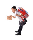 Sweet little girl carrying very heavy backpack or schoolbag full of school material