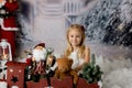 Sweet little girl with christmas decorations, playing Royalty Free Stock Photo