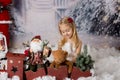 Sweet little girl with christmas decorations, playing Royalty Free Stock Photo