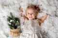 Sweet little girl with christmas decorations, playing Royalty Free Stock Photo