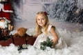 Sweet little girl with christmas decorations, playing Royalty Free Stock Photo