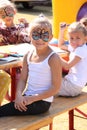 Sweet little girl with face paint at Festival Royalty Free Stock Photo