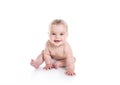 Sweet little girl on the floor of studio white background Royalty Free Stock Photo