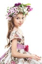 Sweet little girl with floral head wreath. Royalty Free Stock Photo