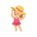 Sweet little girl in a pink swimsuit and straw hat, kid playing at the beach, happy infants outdoor activity on summer