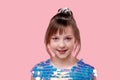 Sweet little girl in shiny dress. Hair is collected in a ponytail. Royalty Free Stock Photo
