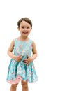 Sweet little girl smiling in beautiful blue dress isolated on white background Royalty Free Stock Photo