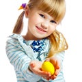 Sweet little girl with yellow Easter egg