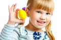 Sweet little girl with yellow Easter egg