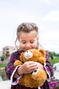 Sweet little holding teddy bear in her arms Royalty Free Stock Photo